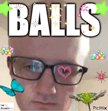 a man wearing glasses is surrounded by balls