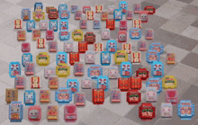 a bunch of boxes on a tiled floor one of which says ' nsn ' on the front