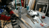 a man wearing a shirt that says ' liberty ' on it is welding a piece of metal