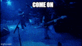 a picture of a band on stage with the words cuz i will never let you know