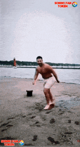 a man without a shirt is dancing on a beach with sommi fan token written on the bottom