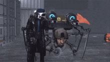 a man in a gas mask stands next to a robot that has a sign on it that says ' a '