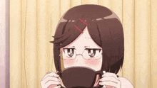 a girl wearing glasses is drinking from a black cup