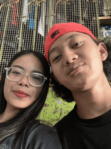 a man and a woman are posing for a picture
