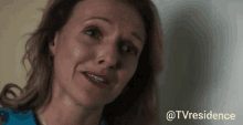 a close up of a woman 's face with the words @tvresidence in the corner