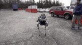 a red suv is parked in a parking lot