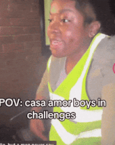 a man wearing a yellow vest with the words pov casa amor boys in challenges