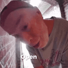 a person with the word open on the bottom