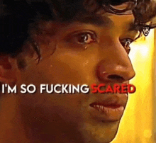 a close up of a man 's face with the words `` i 'm so fucking scared '' written above him .