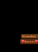 a woman taking a selfie next to a message that says minnosun