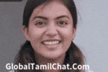 a close up of a woman 's face with the website globaltamilchat.com written in the corner