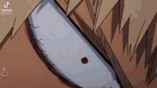 a close up of a cartoon character 's eye with a red spot on it .