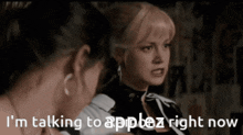a woman is talking to another woman and the words i 'm talking to appez right now are on the screen