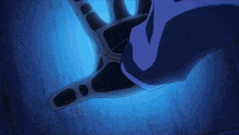 a close up of a person 's hand in a blue background