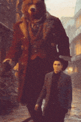 a man in a suit is standing next to a giant bear