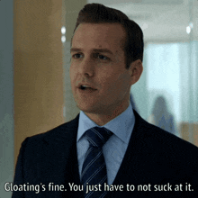a man in a suit and tie is saying " gloating 's fine you just have to not suck at it "