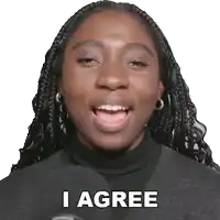 a woman with braids says i agree in front of a microphone