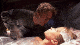 a man is pointing at a woman wrapped in plastic with the words showtime on the bottom