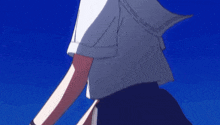 a close up of a girl 's shoulder with a blue background
