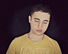a man wearing a yellow t-shirt with the word patent on it