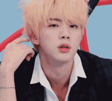 a close up of a man with blonde hair