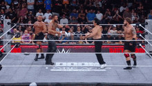 a group of wrestlers are in a ring that says doom the dark age buy now