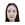 a blurry picture of a woman 's face with long black hair on a white background .