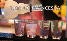 a bartender pours a drink into a shot glass with the words let 's go francesca on the bottom