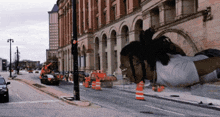 a man is doing push ups on the side of the road