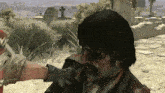a man with blood on his face is being attacked by another man in a video game