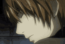 a close up of a person 's face with a very dark background