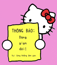 hello kitty is holding a yellow sign that says " thông báo "