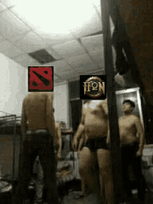 a group of men are standing in a room with a sign that says hon on it ..