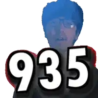 a man wearing glasses holds up the number 935 in front of him