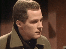 a close up of a man 's face and neck