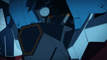 a close up of a blue and white robot with a yellow shield