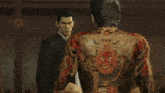 a man with a tattoo on his chest says yeah i 'm gonna serve your ass myself