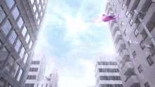 a person is flying through the air between two buildings