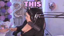 a woman wearing headphones and a cat ear headband says this