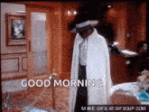 a man in a white coat is standing in a room with the words `` good morning '' written on it .