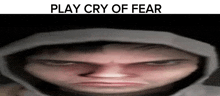 a man in a hoodie is making a funny face and the words `` play cry of fear '' are above him .