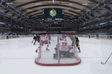 a hockey game is being played in a stadium with a scoreboard that says nordlo on it