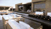 a rendering of a house with a swimming pool and a table with black balls on it