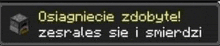 a sign that says osiagniecie zdobyte zesrates sie i smierdzi on it