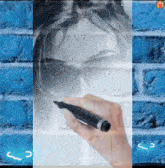 a person is drawing a picture of a woman 's face with a pen