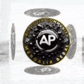 a black and gold coin with the letter ap in the center