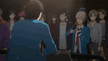 a man in a blue jacket is standing in front of a crowd of people