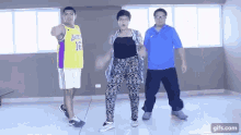 a man wearing a lakers jersey is pointing at the camera