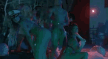 a man and a woman are dancing together at a party .