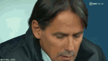 a close up of a man 's face with a bt sport logo in the corner